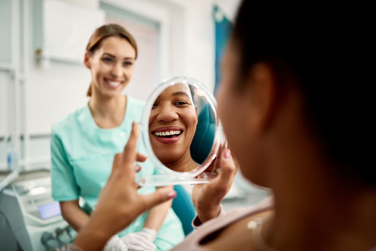 Patient with sensitive teeth receiving professional whitening