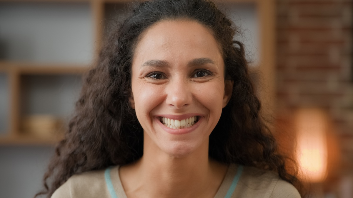Patient with a healthy smile after a dental crown